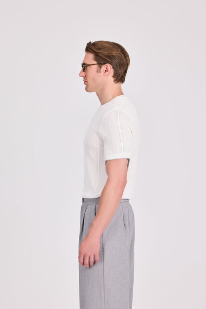 بلوزة محبوكة باللون الأزرق البحري برقبة دائرية